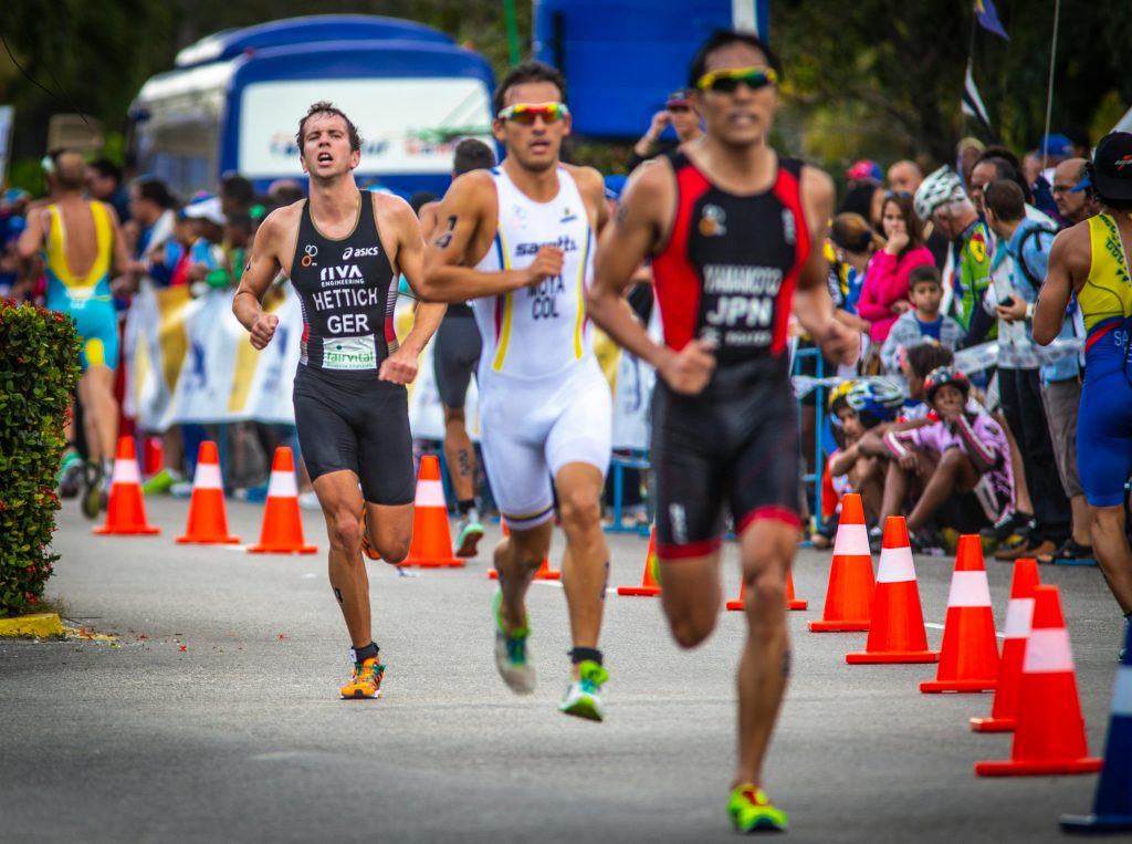 Long-distance athlete in mid-stride during running event