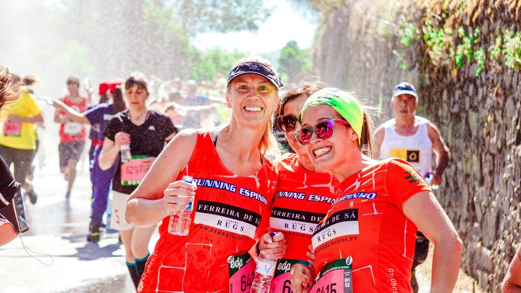 Runner following timed hydration plan at marathon fluid station.