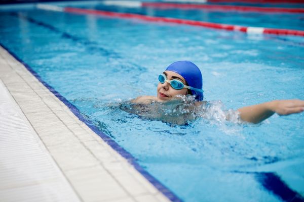 A swimmer performing laps as part of cross-training for a marathon.