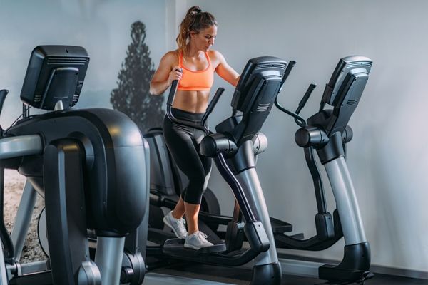 A runner using the elliptical machine for cross-training.