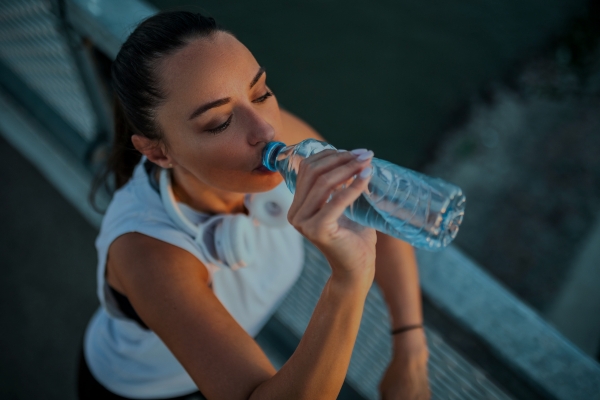 Runner drinking water.