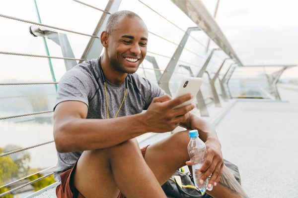 A runner reviewing their split times on a mobile device.