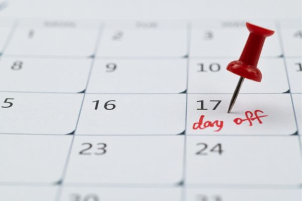 A runner marking their weekly day off on a calendar.