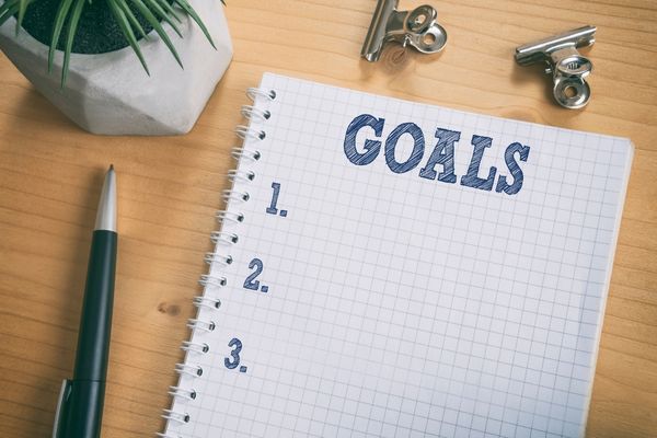 A picture of a notebook to write down future race goals.