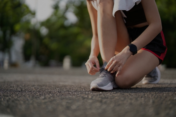 Runner tying shoe.