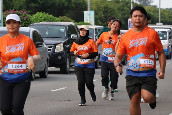 A marathon runner pacing themselves in hot conditions.