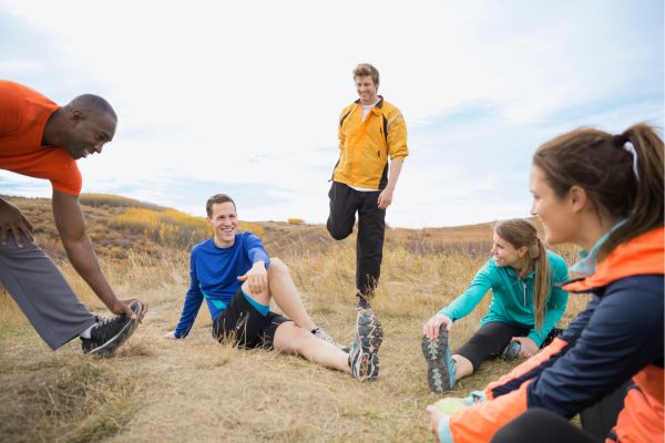 Group of runners stretching together before a race