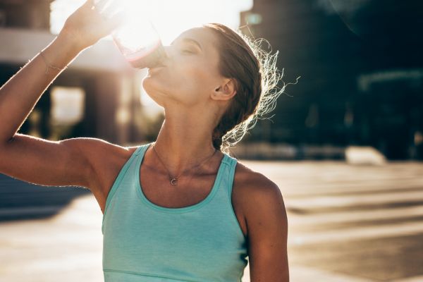 Runner drinking water during a race