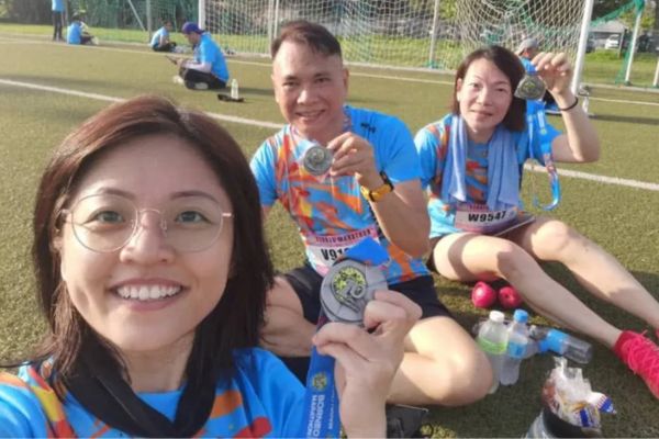 Male and female winners receiving medals at Borneo Marathon